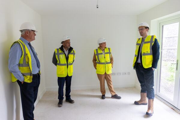 4 people inside a house being built
