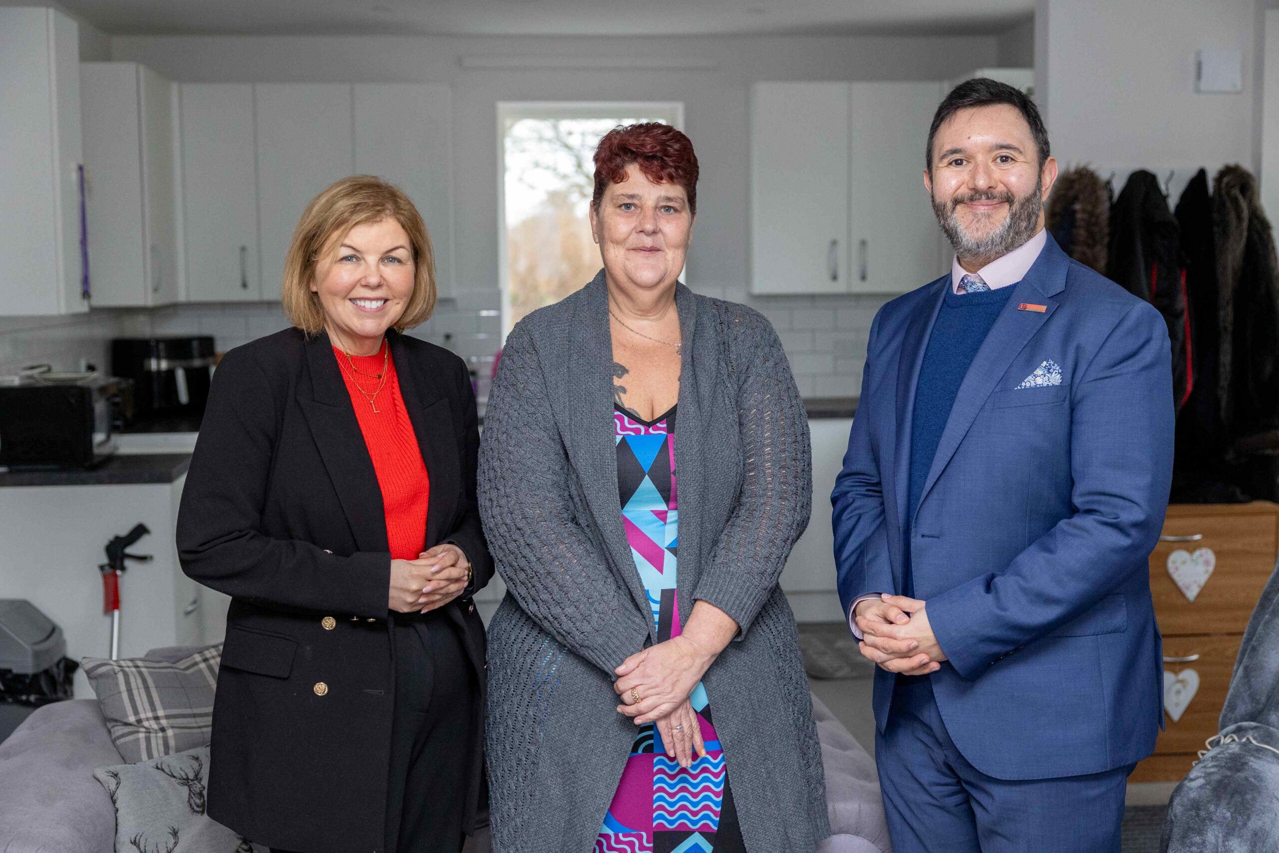 threepeople in a kitchen